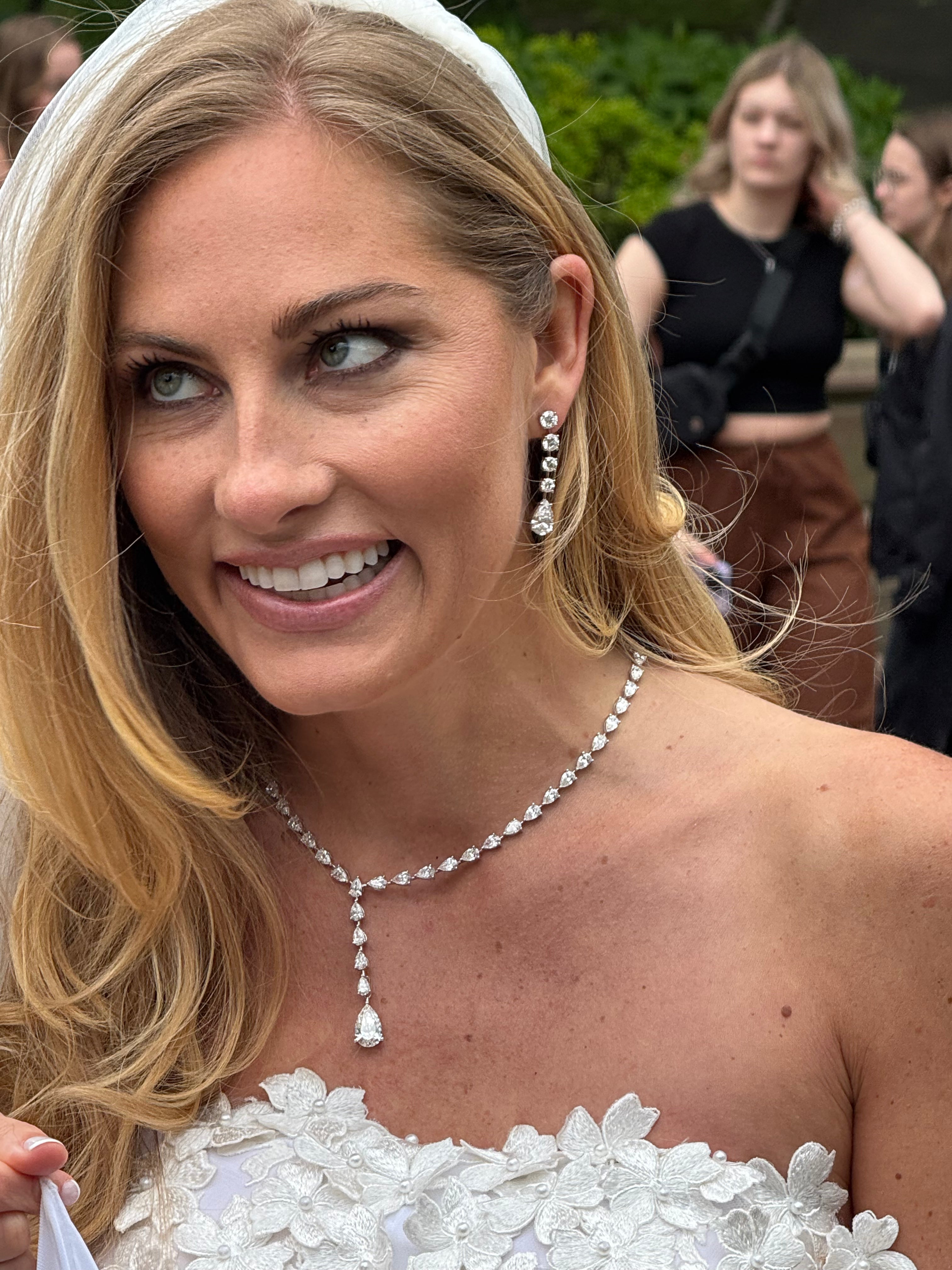 Graduated Round Diamonds and Pear Dangling Earrings